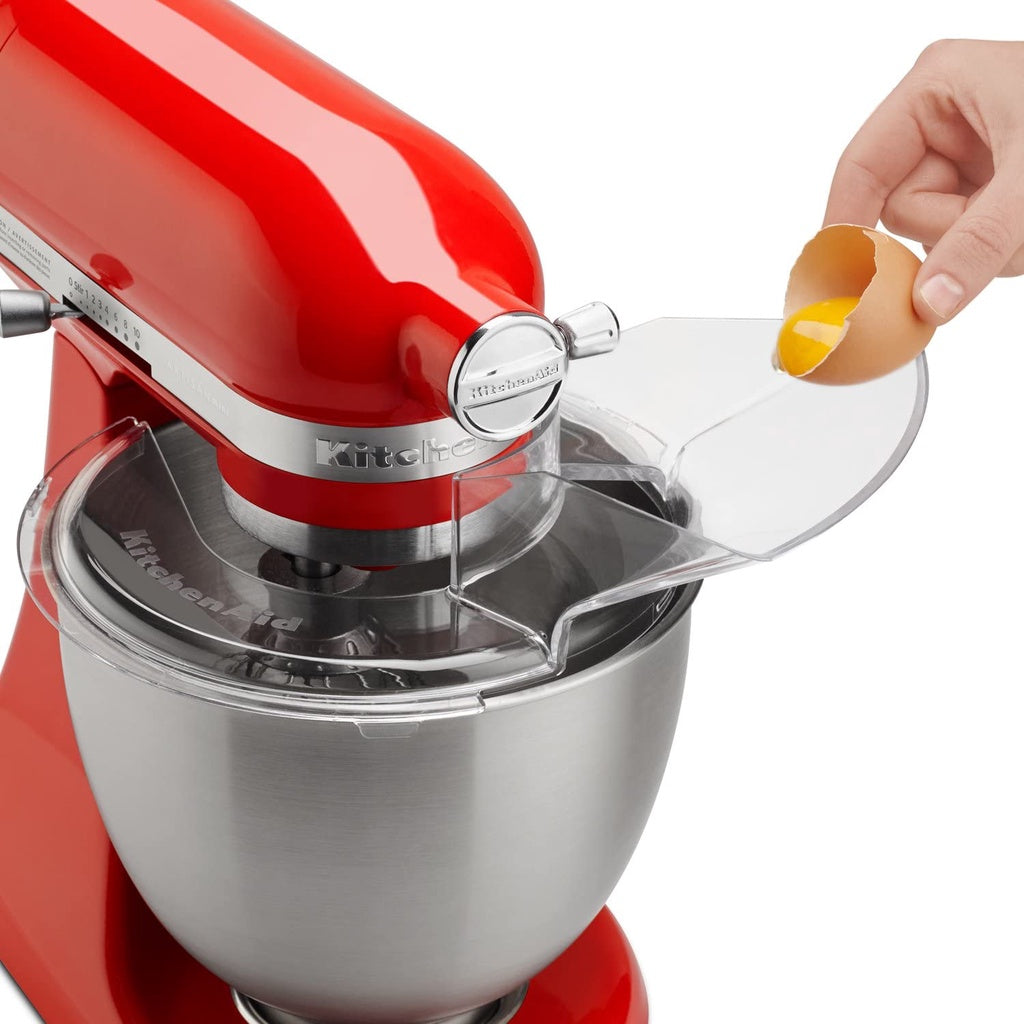 Adding ingredients through the pouring shield