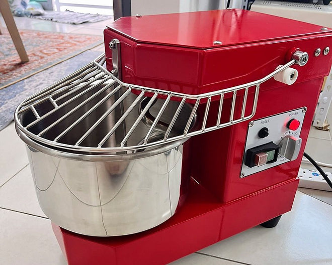 Customer photo of a red Golden Chef DH-8 spiral mixer with its bowl, spiral hook and safety grill