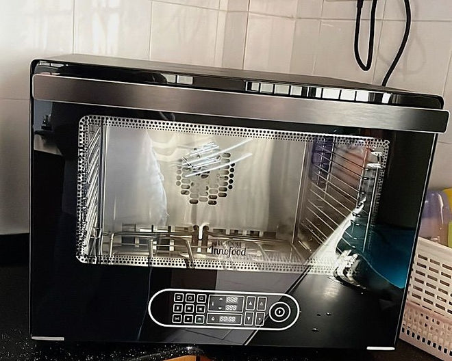 Customer photo of an Innofood KT-V88 convection oven on a kitchen countertop