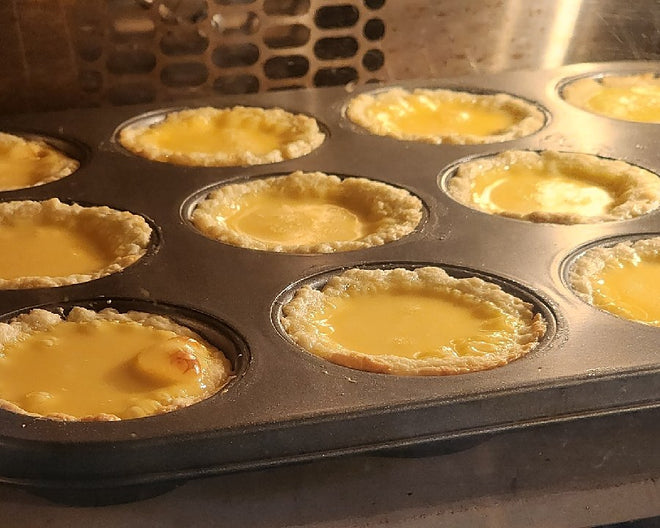 Tray of egg tarts baking inside an Innofood KT-V88 convection oven