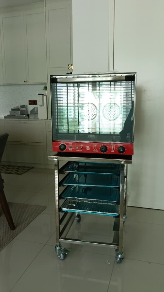 Customer's Soner SCO-4MF convection oven on its stand after delivery