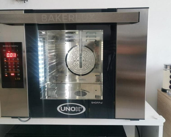UNOX BAKERLUX SHOP.Pro oven running with its light on, photo from a Shopee review